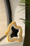 trendy tufted mirror