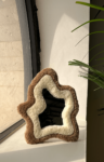 trendy tufted mirror